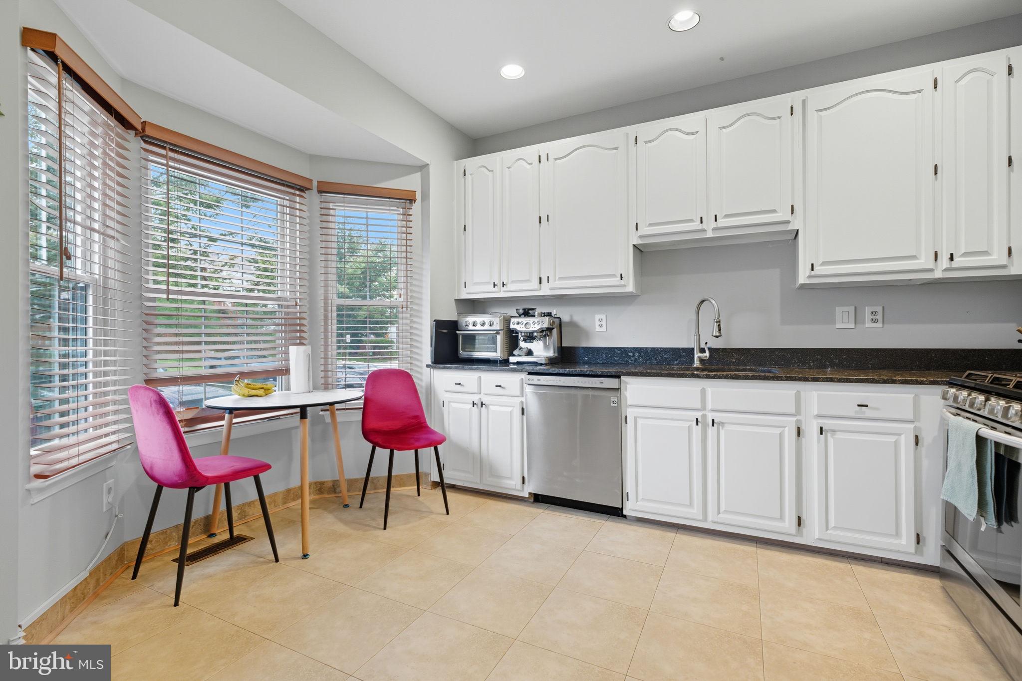 47587 Comer Square Sterling, VA 20165 - Photo 9 of 77 a kitchen with stainless steel appliances granite countertop a white cabinets and a dishwasher