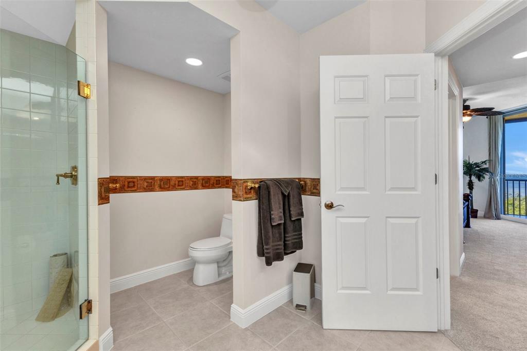 3321 Sunset Key Circle, Unit 502 Punta Gorda, FL 33955 - Photo 25 of 36 a bathroom with a toilet and a shower