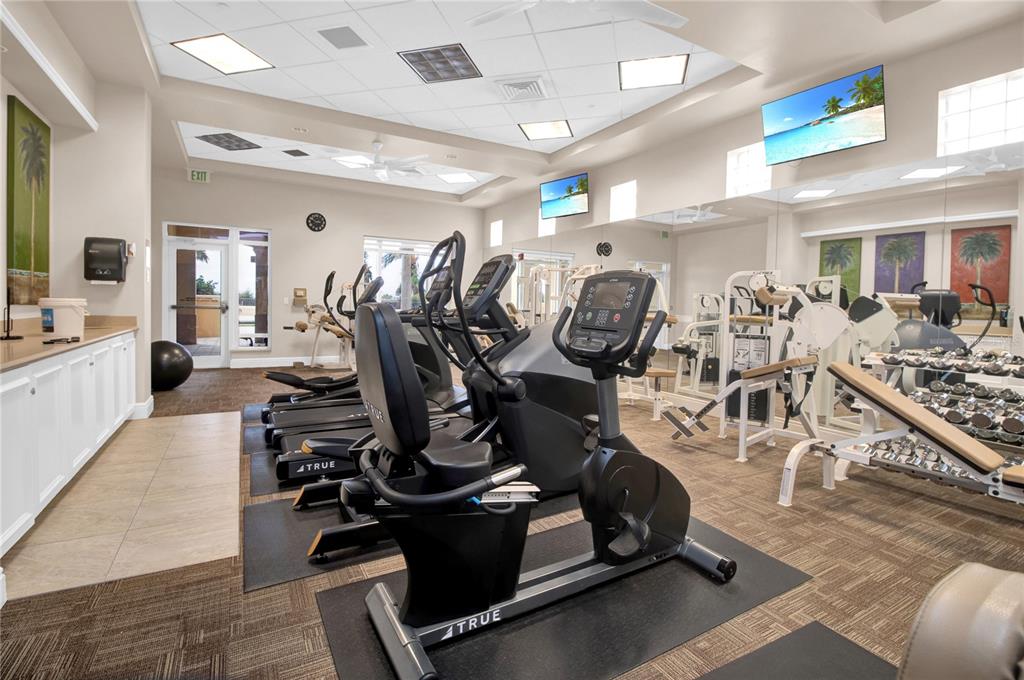3321 Sunset Key Circle, Unit 502 Punta Gorda, FL 33955 - Photo 32 of 36 a room with gym equipment and windows