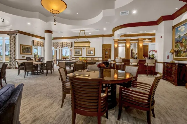 a view of living room with furniture and floor to ceiling windows