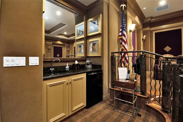 a view of multiple houses with a yard and palm tree