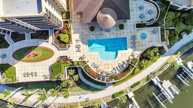 a living room with furniture a flat screen tv and a large window