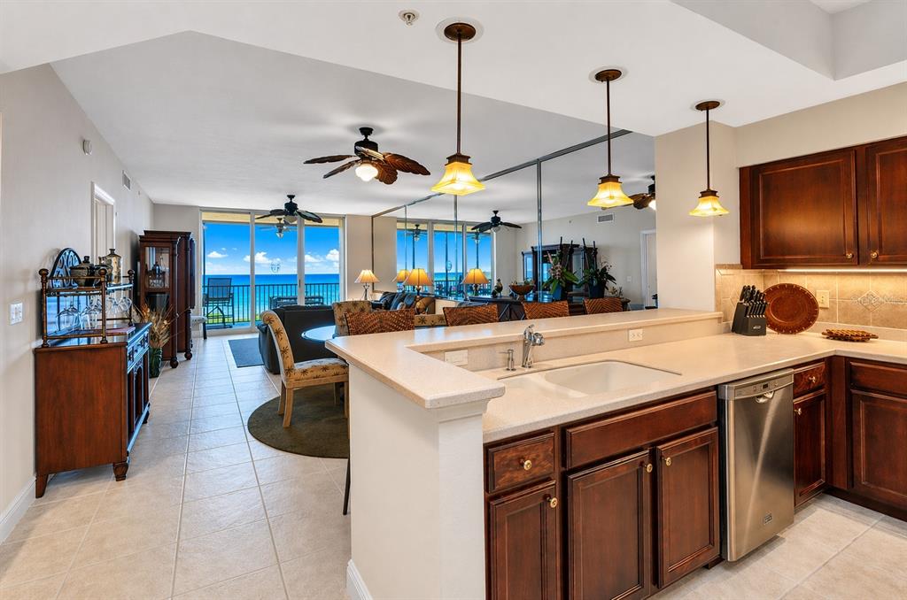 3321 Sunset Key Circle, Unit 502 Punta Gorda, FL 33955 - Photo 8 of 36 a kitchen with a sink a counter space appliances and cabinets