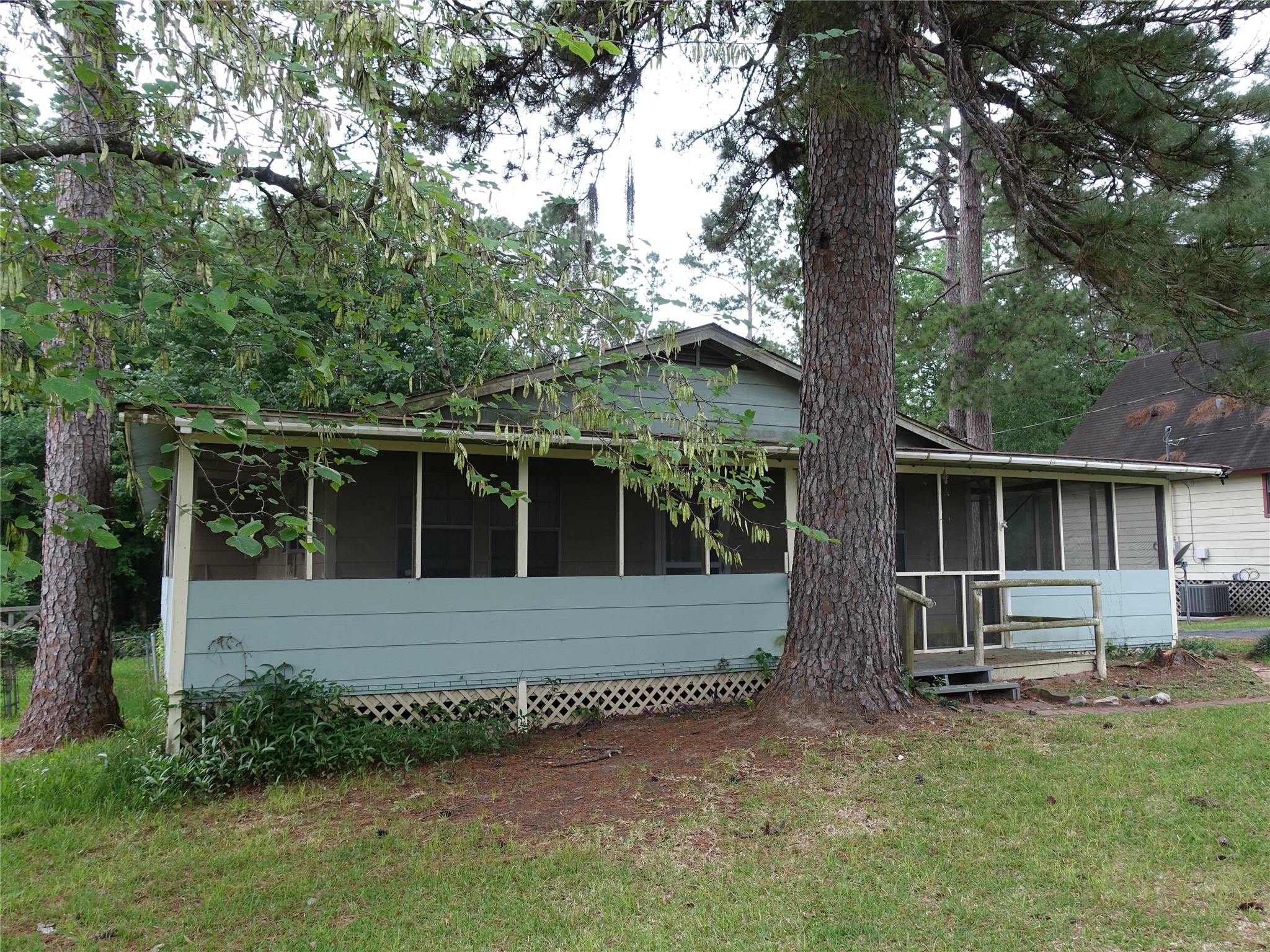 20 Hideaway Trail Coldspring, TX 77331 - Photo 3 of 24 a view of a house with a yard and sitting area