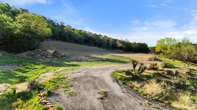 a view of a swimming pool with a yard