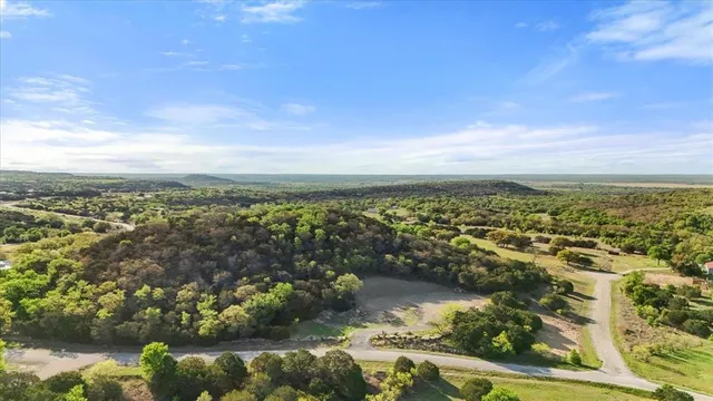 an aerial view of residential building and lake