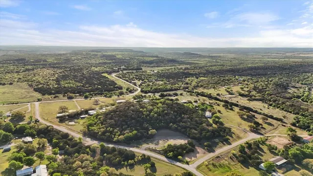 an aerial view of residential building and lake