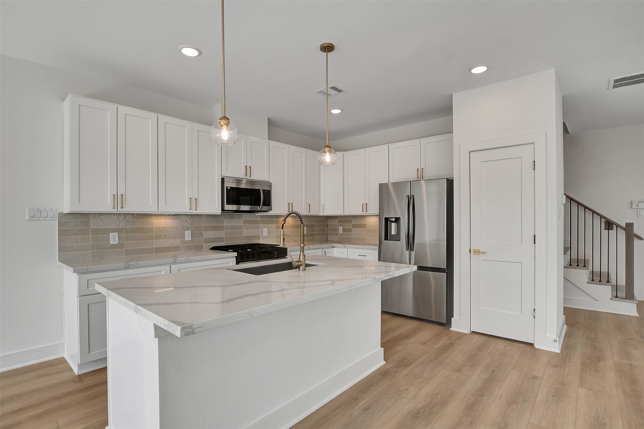 3626 Amos Street Houston, TX 77021 - Photo 11 of 43 a kitchen with stainless steel appliances a refrigerator sink and microwave