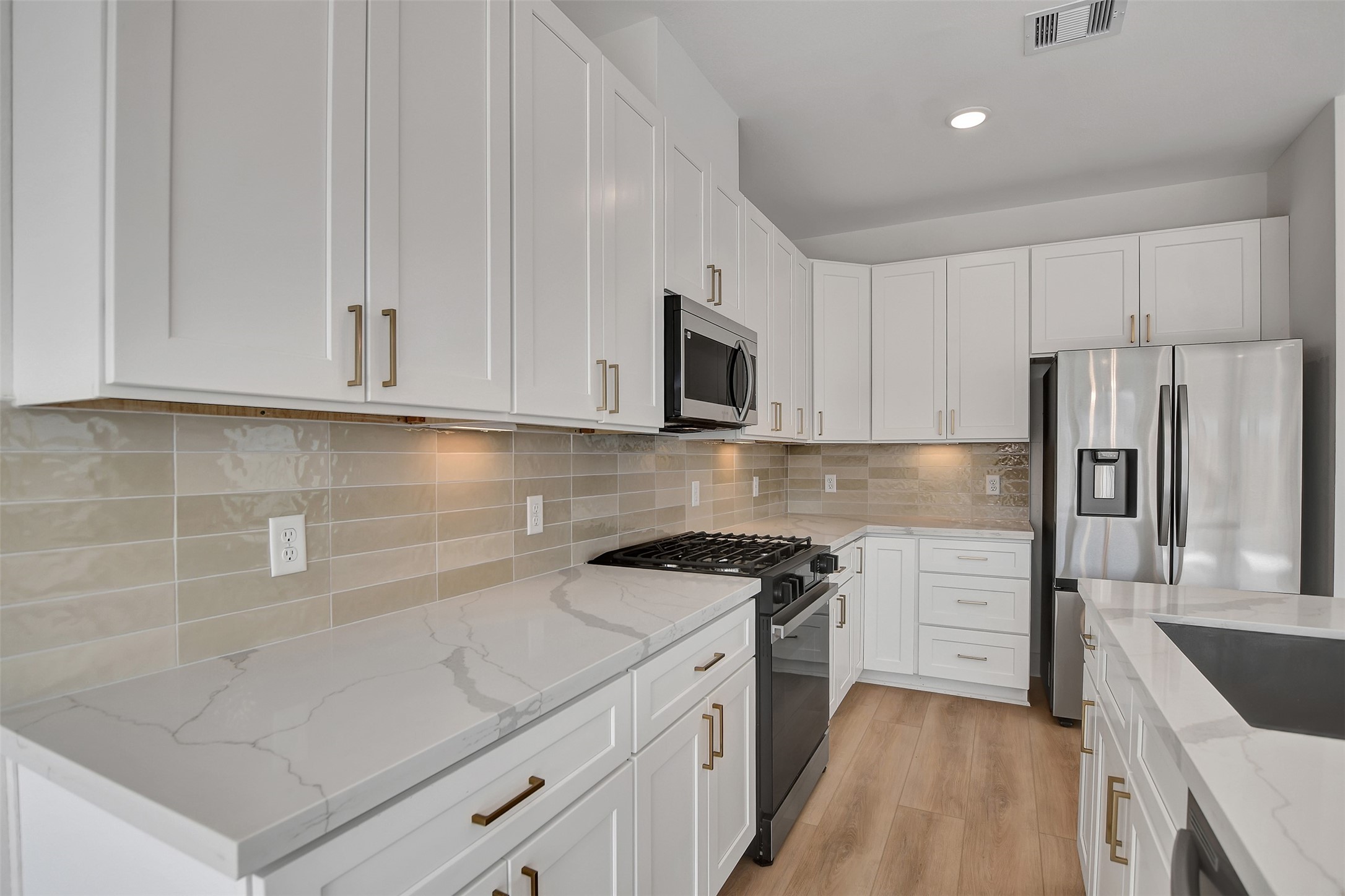 3626 Amos Street Houston, TX 77021 - Photo 15 of 43 a kitchen with a sink stove and refrigerator