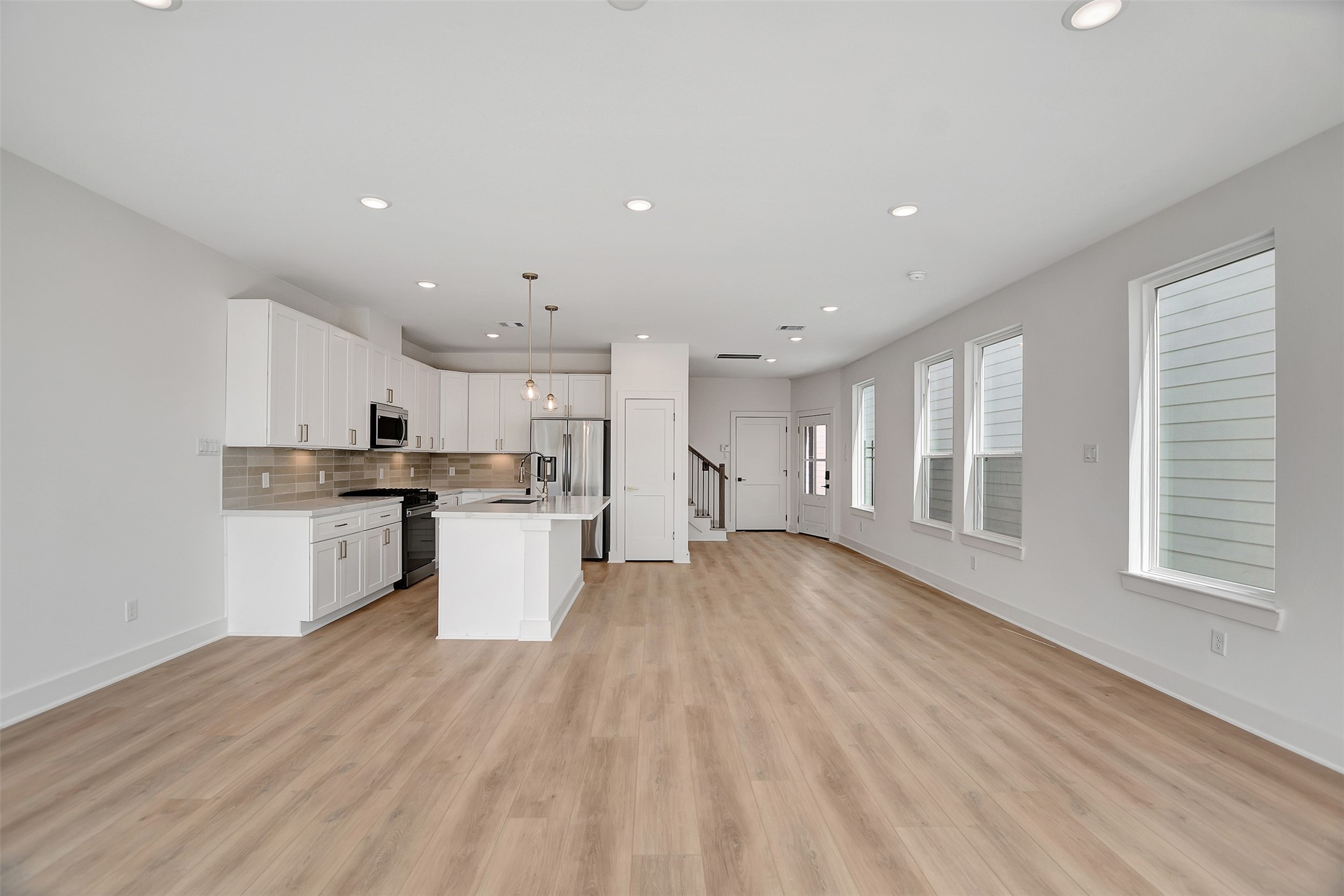 3626 Amos Street Houston, TX 77021 - Photo 22 of 43 a kitchen with a white wooden cabinets and window