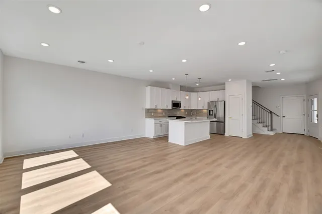 a view of kitchen with wooden floor