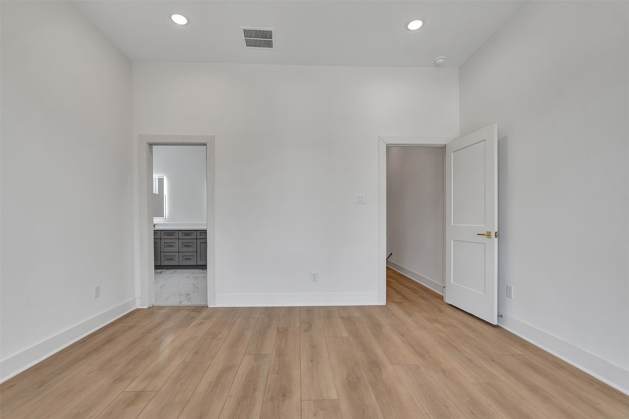 3626 Amos Street Houston, TX 77021 - Photo 27 of 43 an empty room with wooden floor and windows