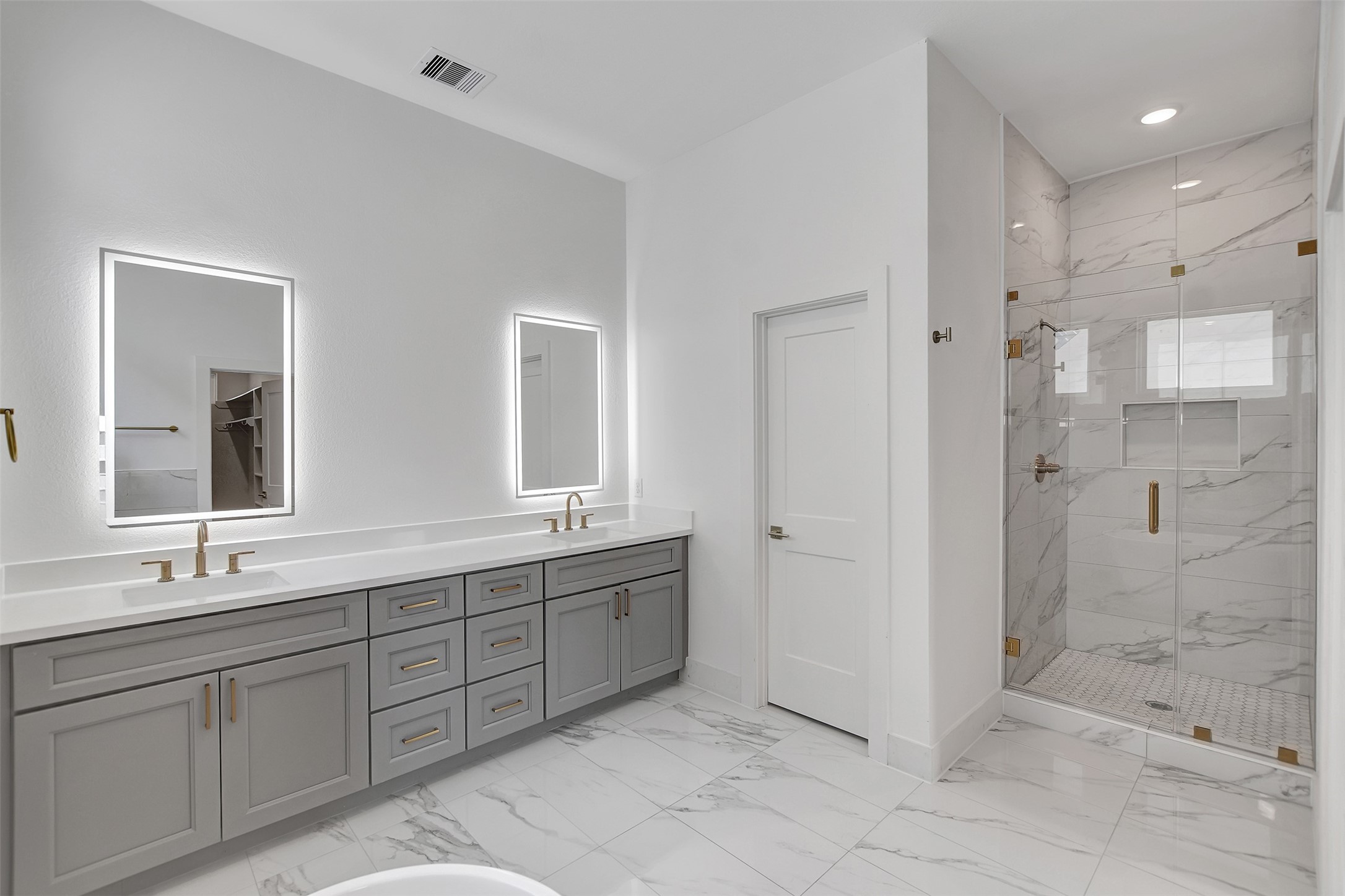 3626 Amos Street Houston, TX 77021 - Photo 29 of 43 a spacious bathroom with a shower sink and mirror