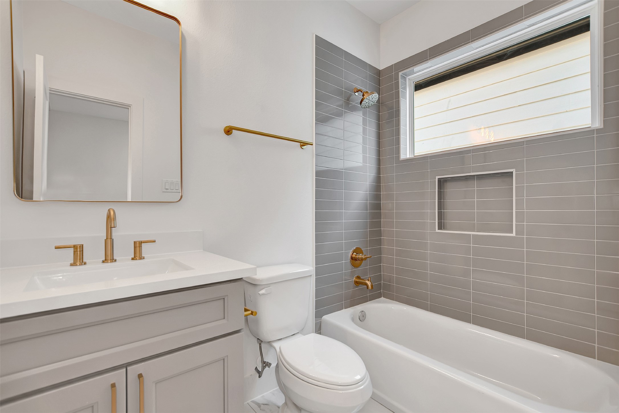 3626 Amos Street Houston, TX 77021 - Photo 39 of 43 a bathroom with a toilet a sink a mirror and a bathtub