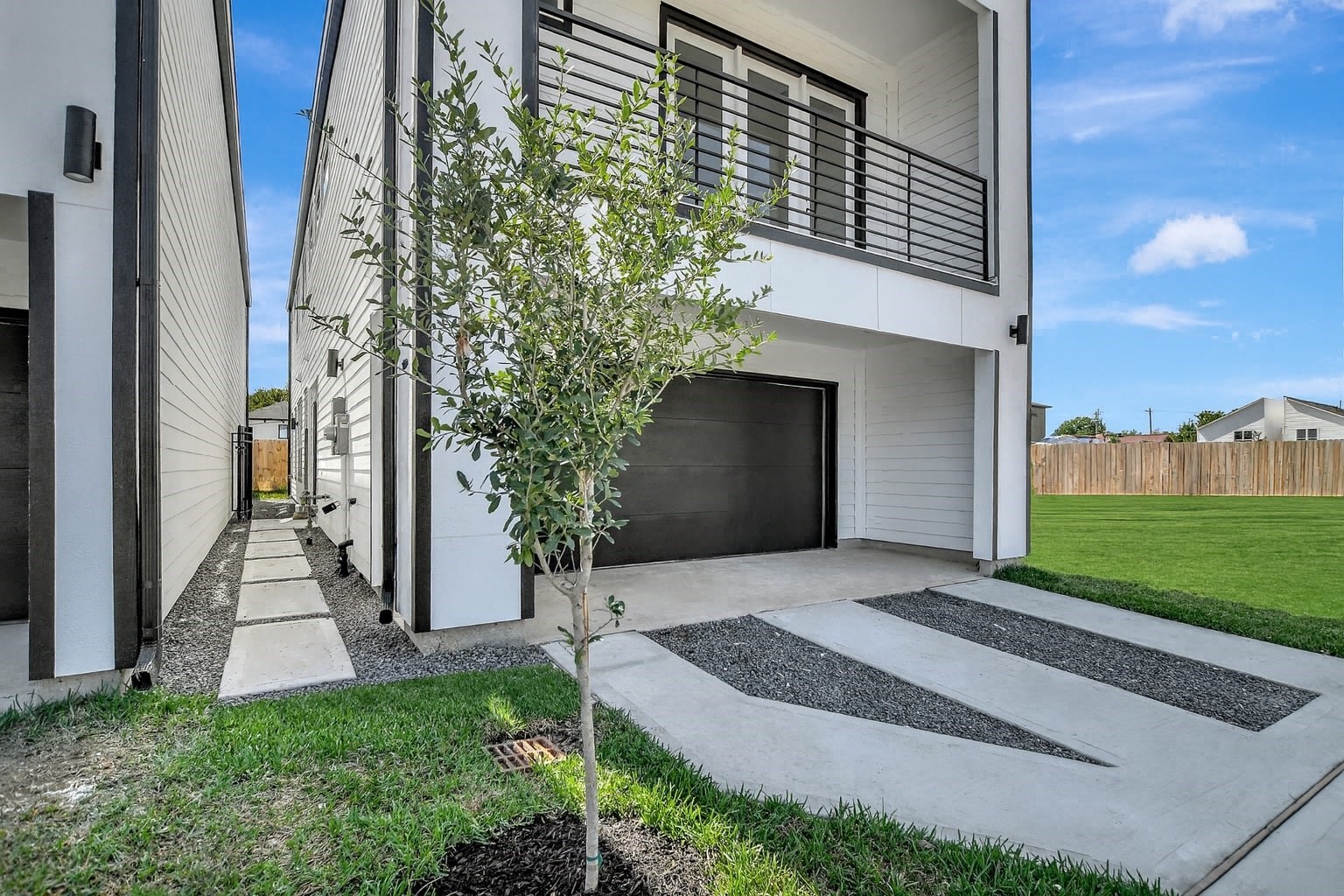 3626 Amos Street Houston, TX 77021 - Photo 4 of 43 a front view of a house with a yard and garage