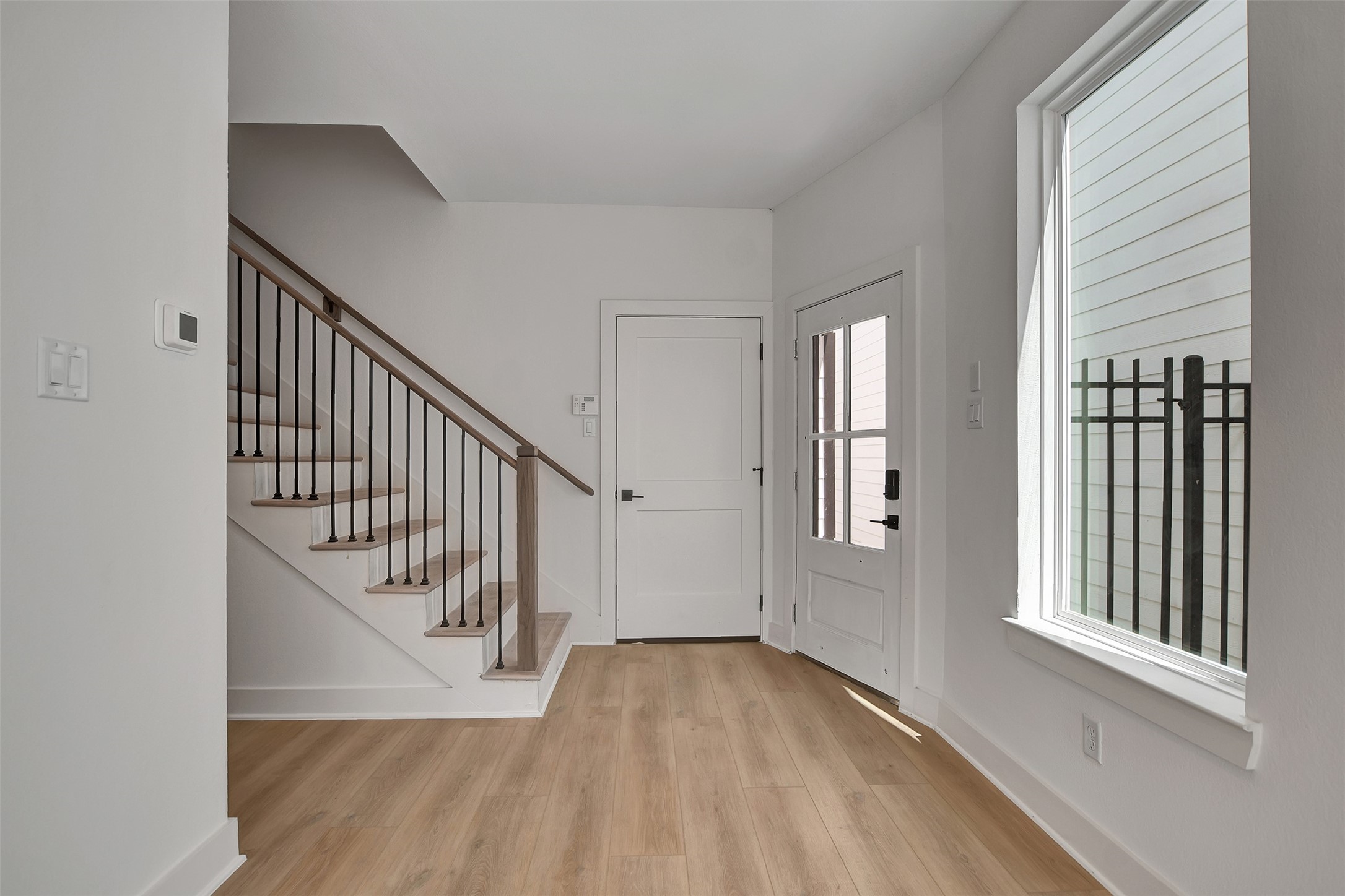 3626 Amos Street Houston, TX 77021 - Photo 7 of 43 a view of entryway and hall with wooden floor