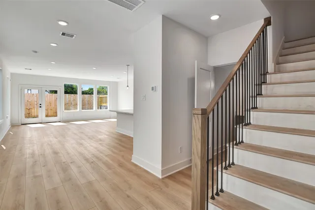 a view of an entryway with wooden floor and windows