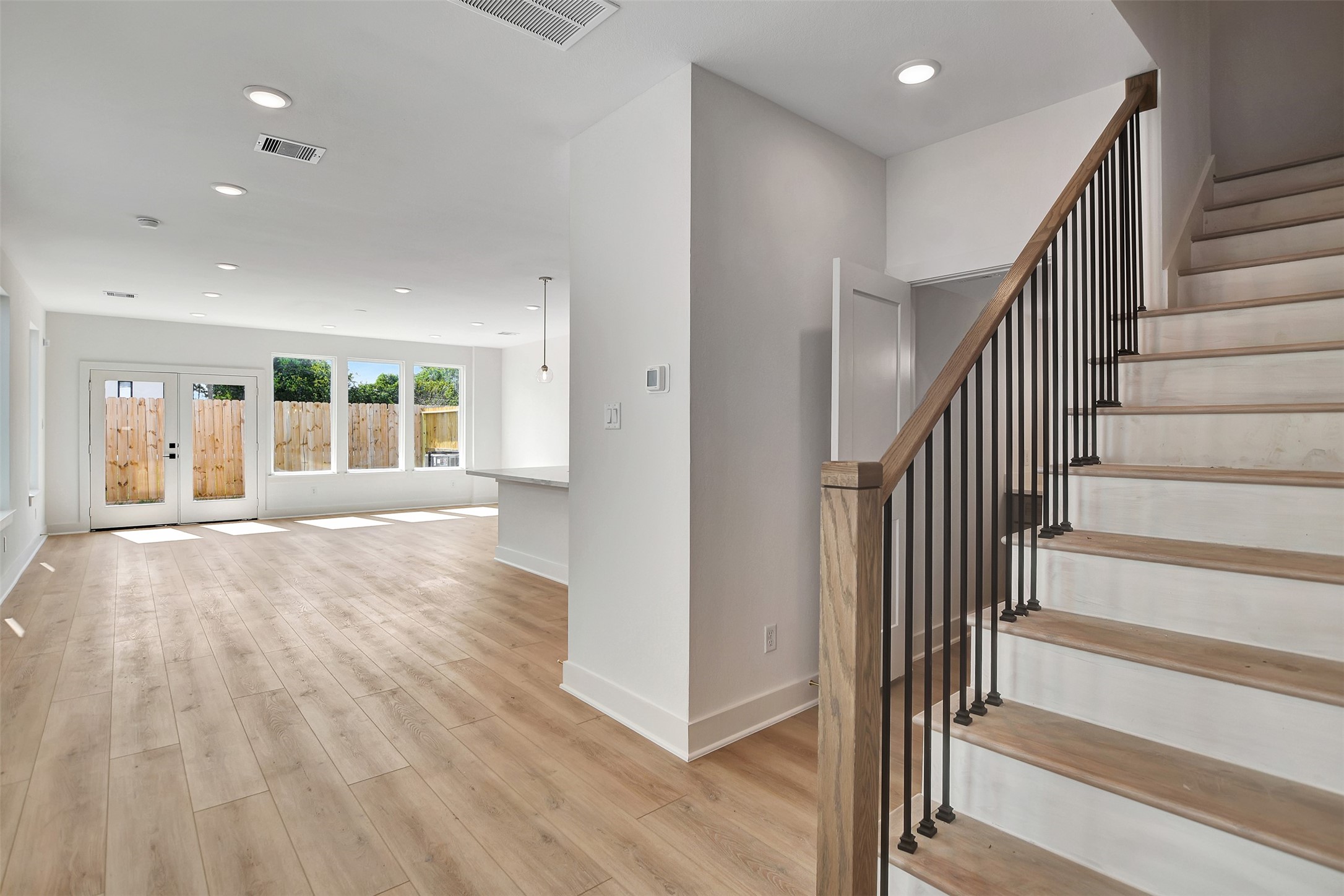 3626 Amos Street Houston, TX 77021 - Photo 8 of 43 a view of an entryway with wooden floor and windows