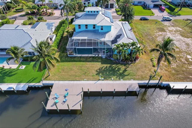 an aerial view of a house with outdoor space swimming pool and outdoor seating