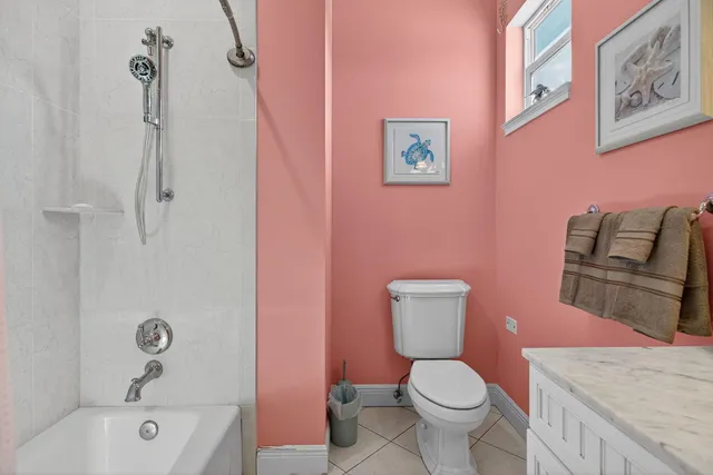 a bathroom with a toilet a sink and bathtub