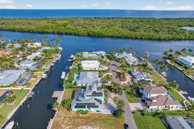 an aerial view of a house with a lake view