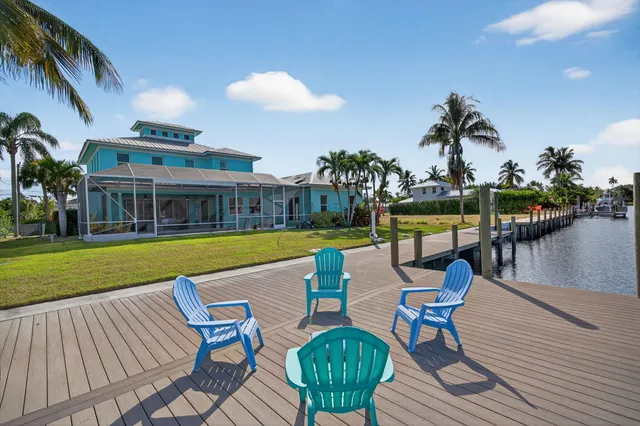 a view of a swimming pool with lounge chairs
