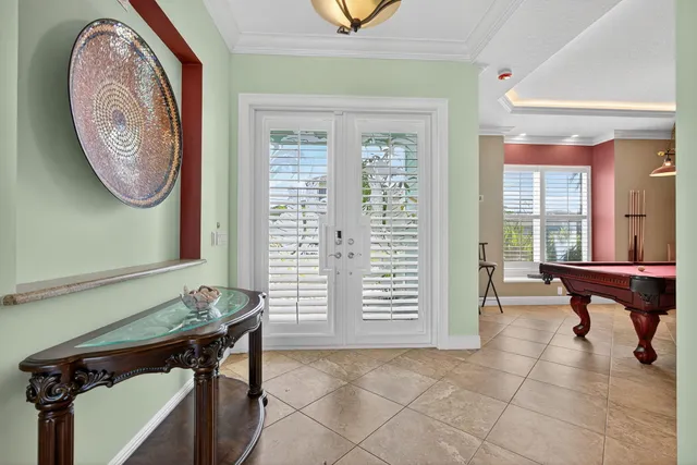 a view of a room with furniture and windows