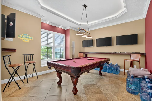a room with furniture and view of kitchen