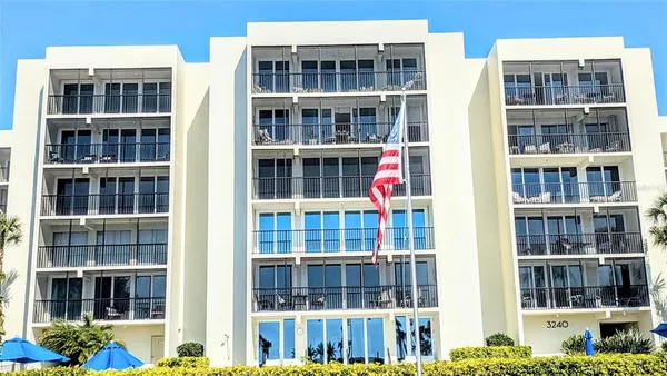 a front view of a building with a lot of windows