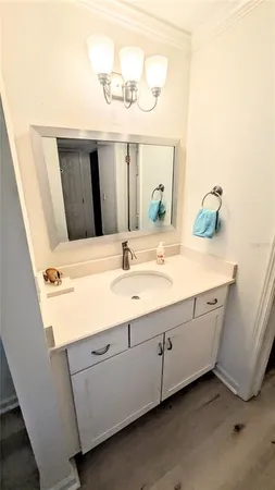 a room with a sink and a mirror