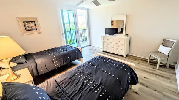 a bedroom with double bed and a window