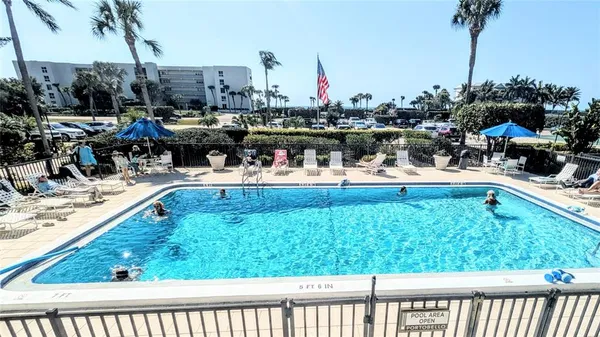 a view of swimming pool with outdoor seating
