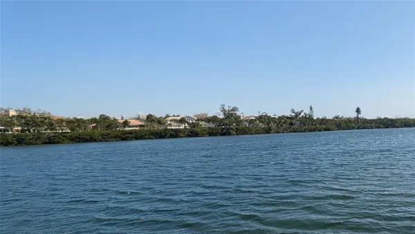 a view of a wooden floor and lake