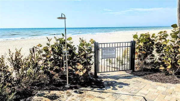 a view of wooden floor in middle of beach