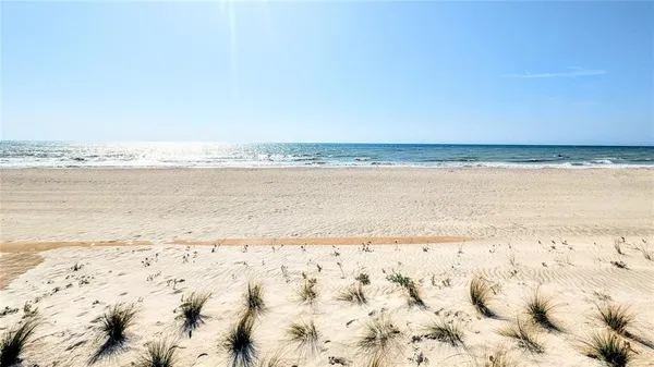 a view of swimming pool with chairs