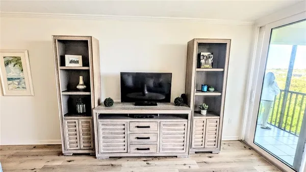 a room with furniture and flat screen tv