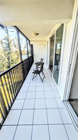 a balcony view with a outdoor seating
