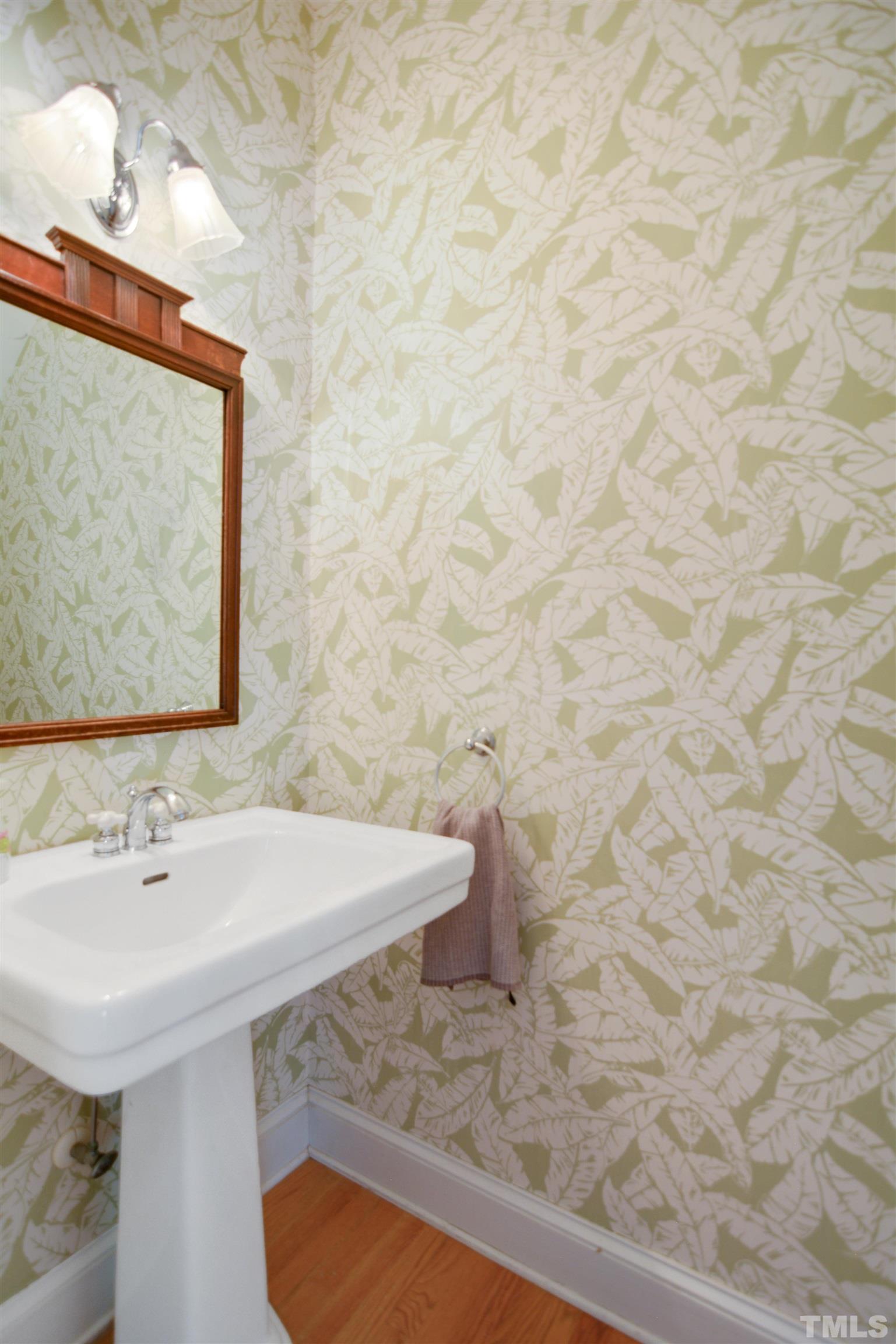 3005 Dunkirk Drive Raleigh, NC 27613 - Photo 14 of 35 a bathroom with a sink and a mirror