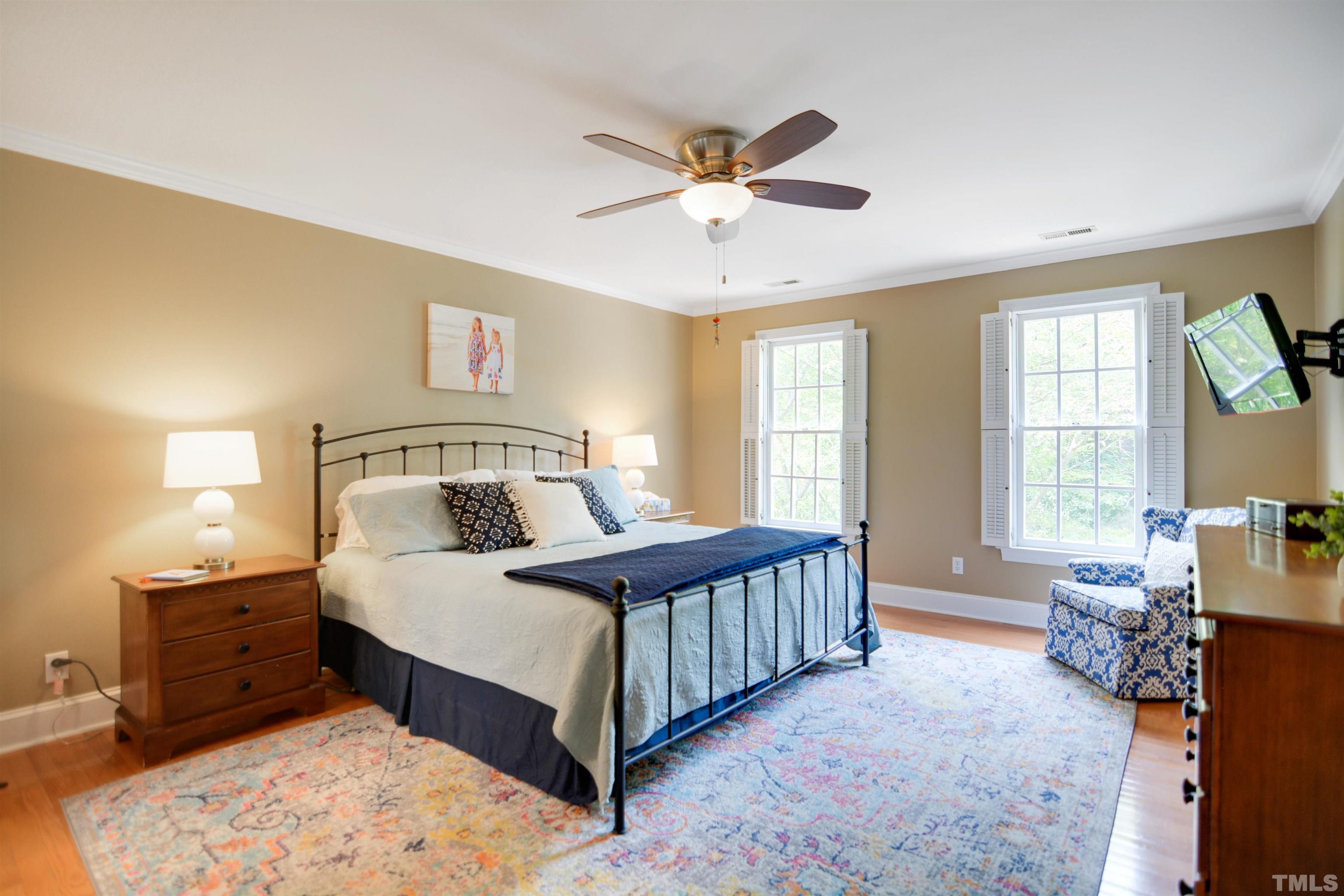 3005 Dunkirk Drive Raleigh, NC 27613 - Photo 15 of 35 a bedroom with a bed chandelier and a window