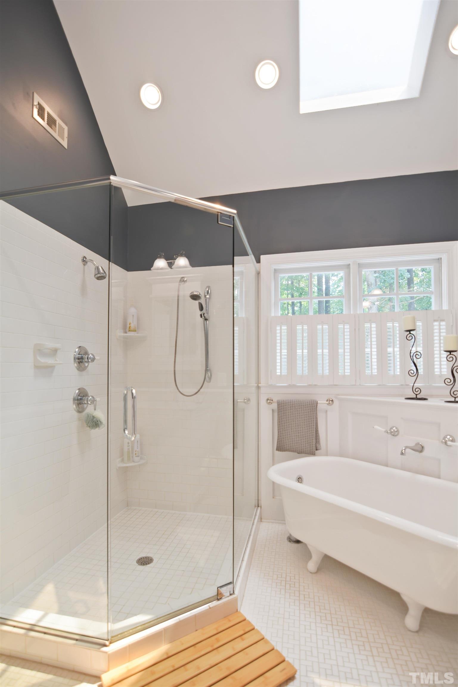 3005 Dunkirk Drive Raleigh, NC 27613 - Photo 17 of 35 a bathroom with a bathtub and a shower