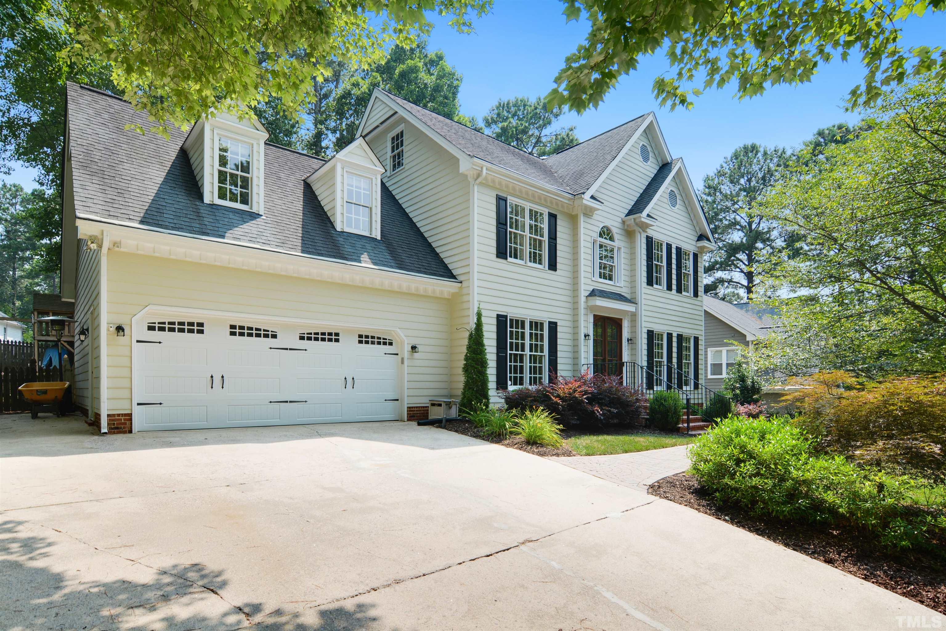 3005 Dunkirk Drive Raleigh, NC 27613 - Photo 2 of 35 a front view of a house with garden