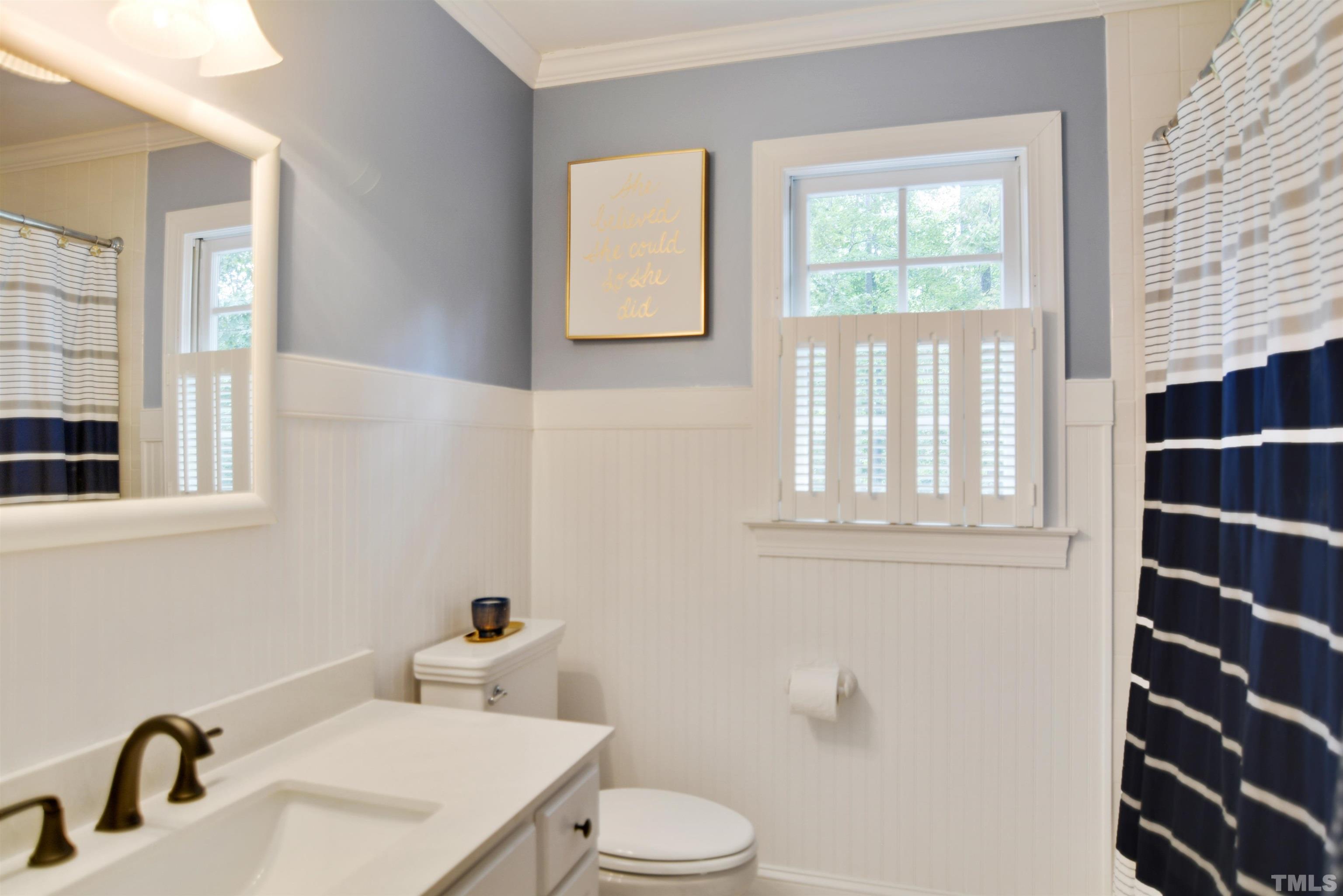 3005 Dunkirk Drive Raleigh, NC 27613 - Photo 21 of 35 a bathroom with a sink and a toilet