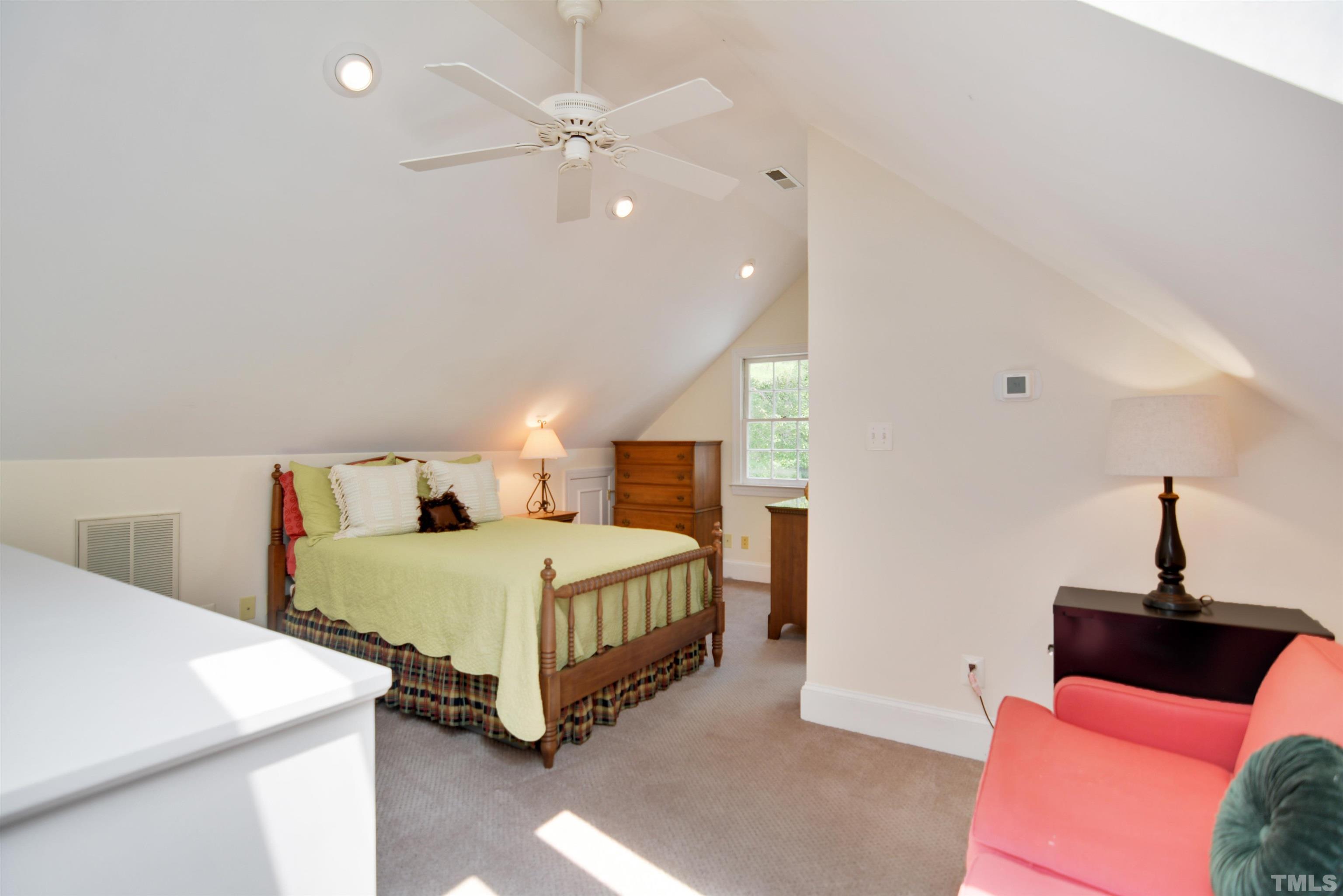 3005 Dunkirk Drive Raleigh, NC 27613 - Photo 26 of 35 a bedroom with two beds and a chandelier