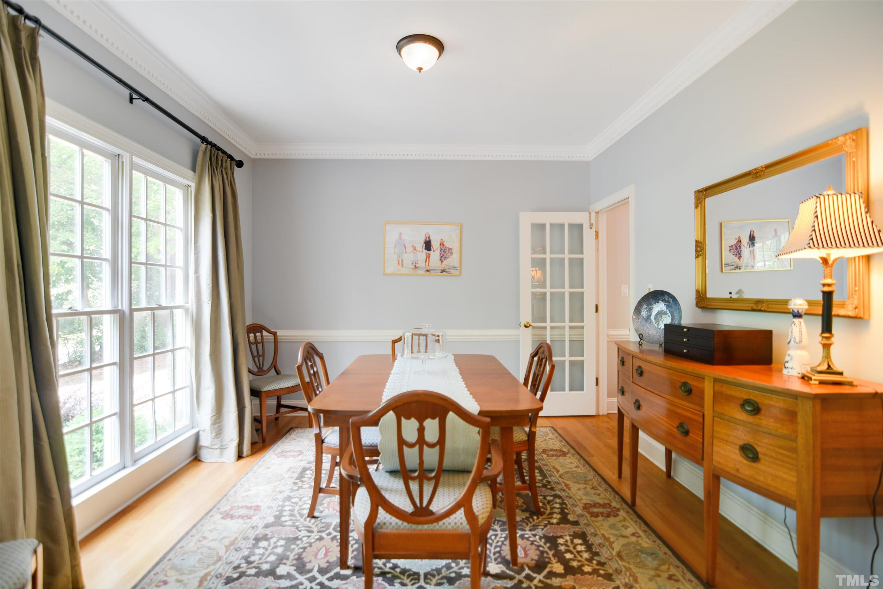 3005 Dunkirk Drive Raleigh, NC 27613 - Photo 6 of 35 a view of a dining room with furniture window and outside view