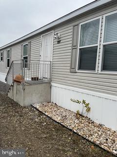 a front view of a house with a wooden fence