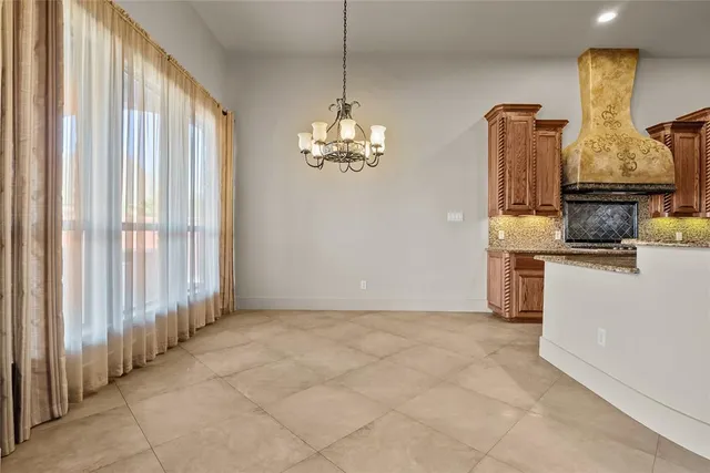 a view of a kitchen with electric appliances