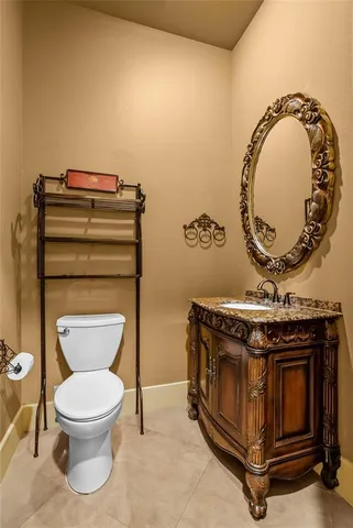 a bathroom with a stove and a mirror