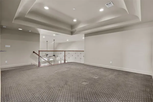 an empty room with windows and pillars in it