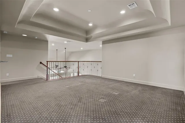 an empty room with windows and pillars in it