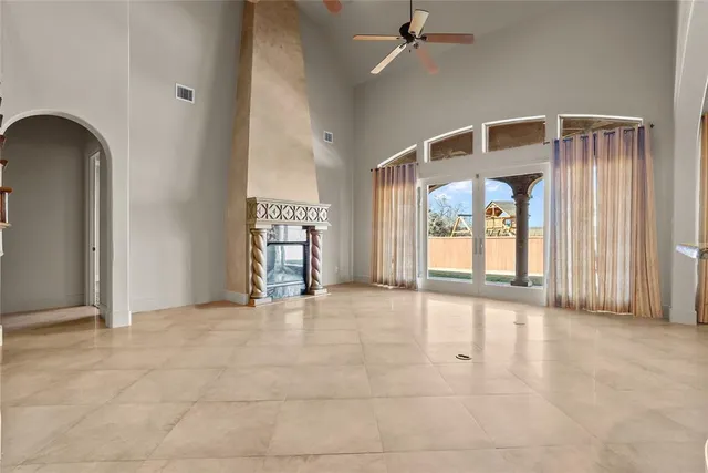 a view of an empty room with a fireplace